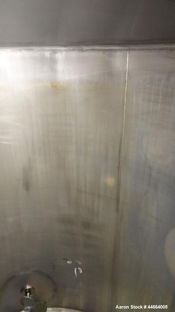 Used Tank, 2000 Gallons, 304 Stainless Steel, Vertical. 78" Diameter X 96" straight side, cone top and bottom. Side bottom entering agitator with a (3) blade prop driven by a 3 hp, 3/60/230/460 volt,...