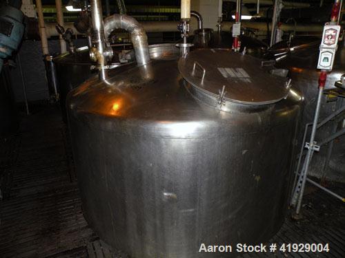 Used Perry Products Tank, 2000 Gallon, 304 stainless steel, vertical. 76" diameter x 106" straight side, dished top and bottom. Openings: top (2) 3" tri-clamp, 4" vent, 8" drive (capped), (2) 24" man...