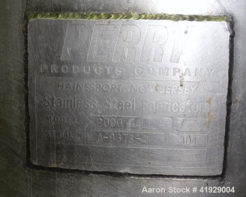Used Perry Products Tank, 2000 Gallon, 304 stainless steel, vertical. 76" diameter x 106" straight side, dished top and bottom. Openings: top (2) 3" tri-clamp, 4" vent, 8" drive (capped), (2) 24" man...