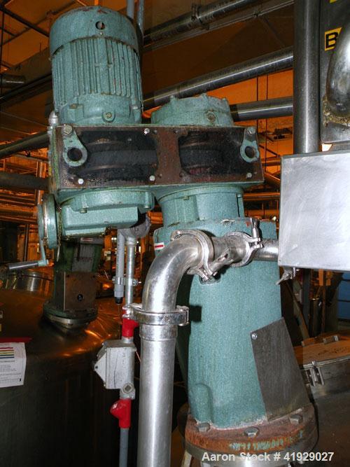 Used Perry Products Tank, 2000 Gallon, 304 stainless steel, vertical. 76" diameter x 106" straight side, dished top and bottom.  Off center top entering angled Lightnin manual variable speed agitator...
