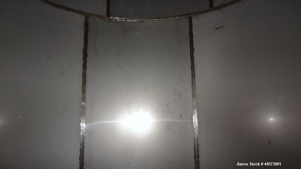 Used REC Industries Tank, 3965 Gallon, 304 Stainless Steel, Vertical, Model 3000.90.144.S.T4.  Approximately 90" diameter x 144" straight side, cone top, flat bottom.  Openings:  top 3-1/2" threaded,...
