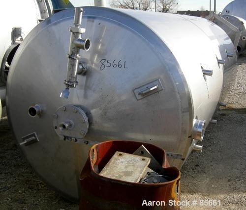 USED: Reimelt pressure tank, 1849 gallon (7000 liter), 304 stainless steel, vertical. 64" diameter x 138" straight side, dished top, coned bottom. Internal rated 13 psi at 122 deg F. (6) Side enterin...