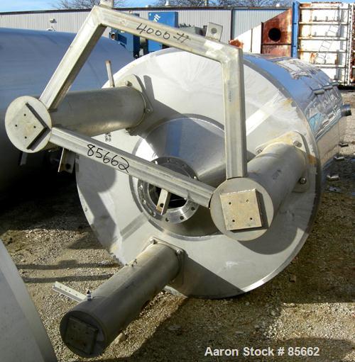 USED: Reimelt pressure tank, 1849 gallon (7000 liter), 304 stainless steel, vertical. 64" diameter x 138" straight side, dished top, coned bottom. Internal rated 13 psi at 122 deg F. (6) Side enterin...