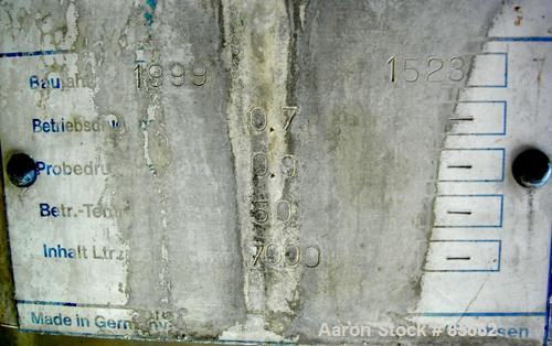 USED: Reimelt pressure tank, 1849 gallon (7000 liter), 304 stainless steel, vertical. 64" diameter x 138" straight side, dished top, coned bottom. Internal rated 13 psi at 122 deg F. (6) Side enterin...