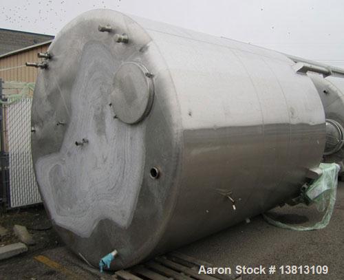 Used Sani Tank Stainless Steel Mixing Tank, 4,000 Gallons.  Side agitated, stainless steel, side and top manways.  Slope bottom with 3" bottom discharge, 5 top inlets:  2.5", 3", 1.5", 2.5".  102" Di...