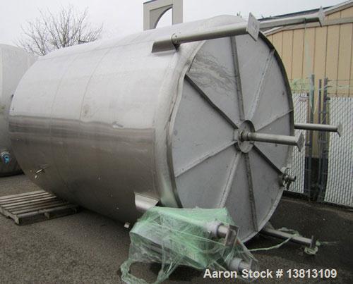 Used Sani Tank Stainless Steel Mixing Tank, 4,000 Gallons.  Side agitated, stainless steel, side and top manways.  Slope bottom with 3" bottom discharge, 5 top inlets:  2.5", 3", 1.5", 2.5".  102" Di...