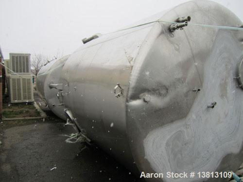 Used Sani Tank Stainless Steel Mixing Tank, 4,000 Gallons.  Side agitated, stainless steel, side and top manways.  Slope bottom with 3" bottom discharge, 5 top inlets:  2.5", 3", 1.5", 2.5".  102" Di...