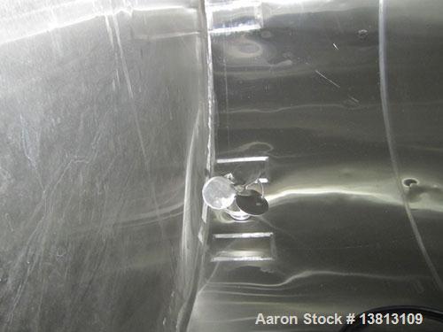 Used Sani Tank Stainless Steel Mixing Tank, 4,000 Gallons.  Side agitated, stainless steel, side and top manways.  Slope bottom with 3" bottom discharge, 5 top inlets:  2.5", 3", 1.5", 2.5".  102" Di...