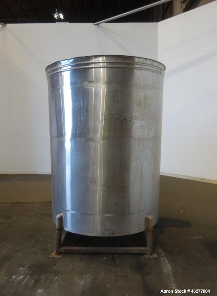 Used San-I-Tanks Tank, Approximately 1,150 Gallons, 304 Stainless Steel, Vertical. Approximately 64" diameter x 81-1/2" straight side. Flat top, sloped bottom. 1-1/2" Off-center bottom outlet. Mounte...