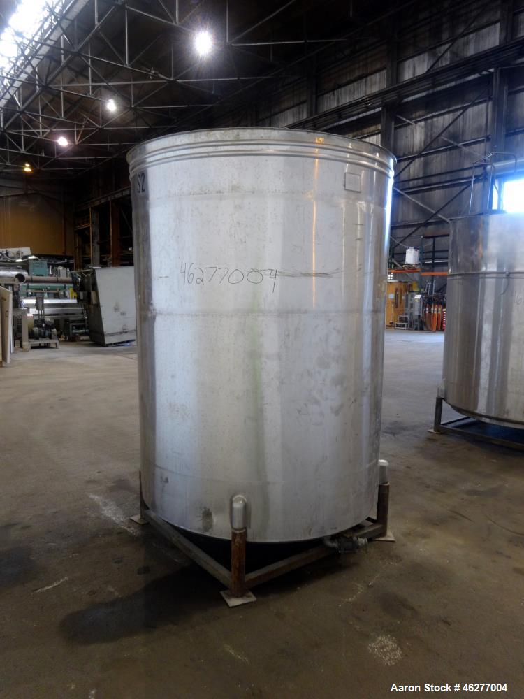 Used San-I-Tanks Tank, Approximately 1,150 Gallons, 304 Stainless Steel, Vertical. Approximately 64" diameter x 81-1/2" straight side. Flat top, sloped bottom. 1-1/2" Off-center bottom outlet. Mounte...