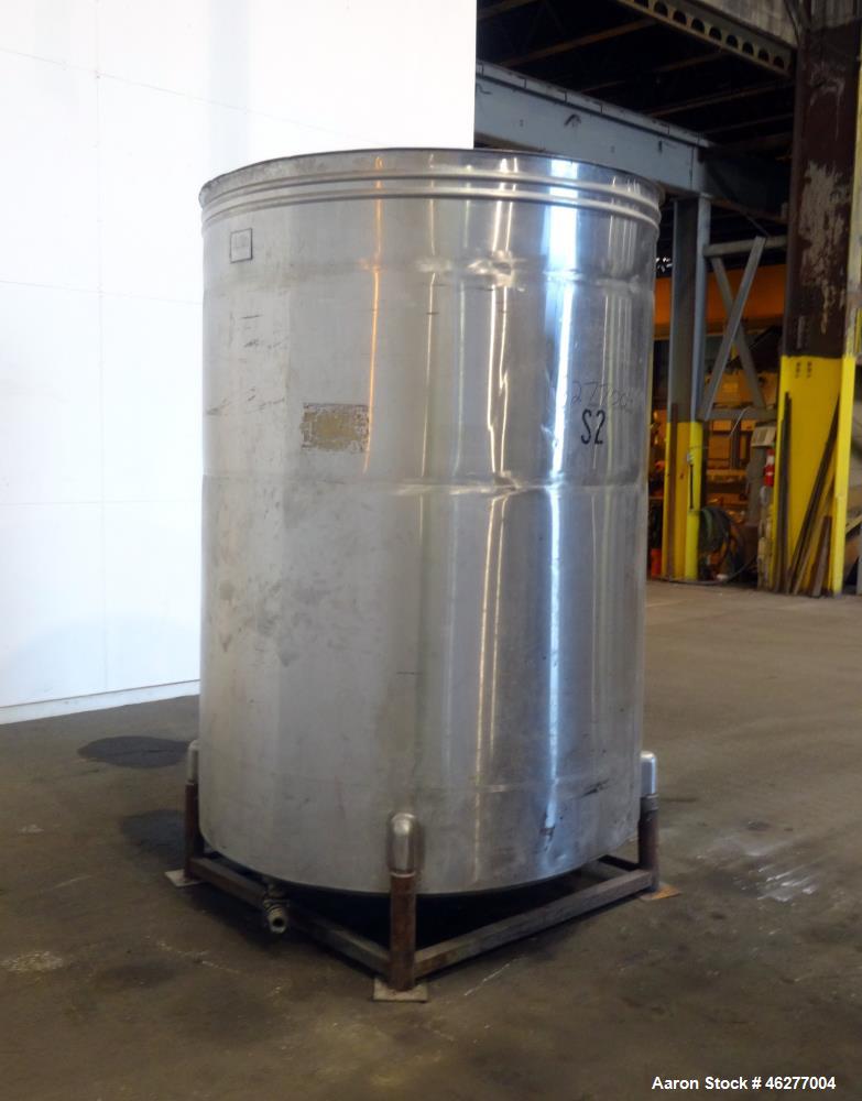 Used San-I-Tanks Tank, Approximately 1,150 Gallons, 304 Stainless Steel, Vertical. Approximately 64" diameter x 81-1/2" straight side. Flat top, sloped bottom. 1-1/2" Off-center bottom outlet. Mounte...
