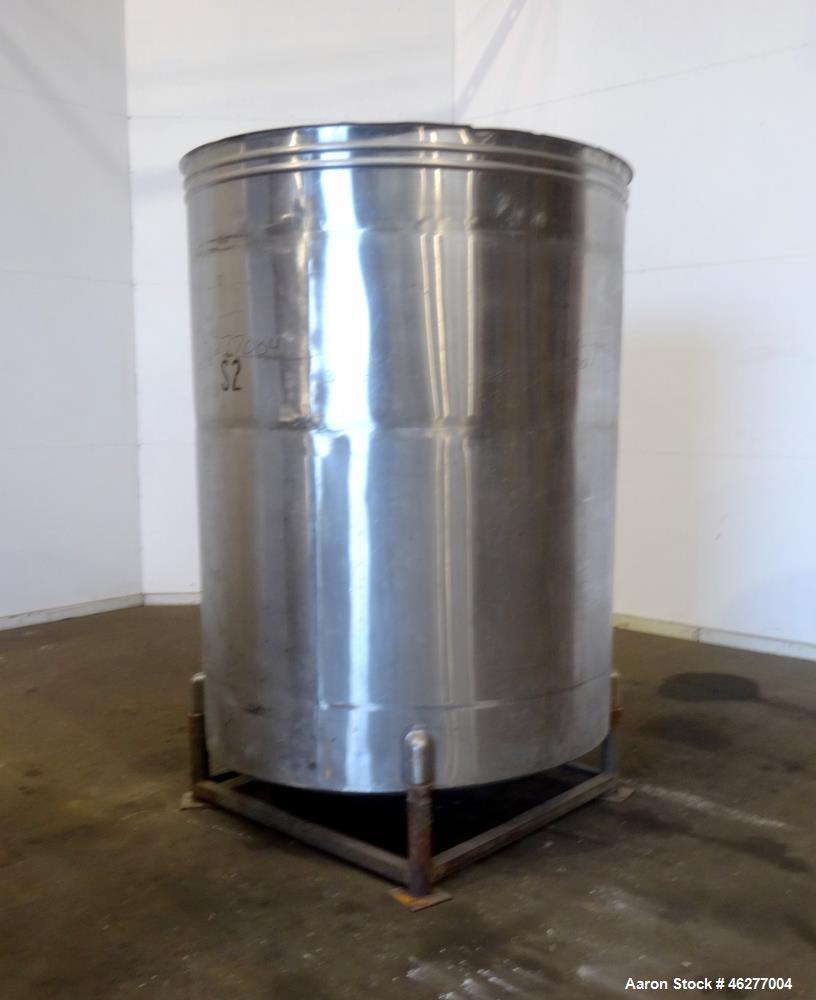 Used San-I-Tanks Tank, Approximately 1,150 Gallons, 304 Stainless Steel, Vertical. Approximately 64" diameter x 81-1/2" straight side. Flat top, sloped bottom. 1-1/2" Off-center bottom outlet. Mounte...