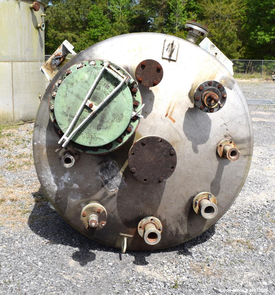Used TPI Industrial Tank, Approximate 1500 Gallon, Stainless Steel, Vertical. Approximate 72" Diameter x 80" straight side, dished top and bottom. Sidewall baffles, top man way, center bottom outlet....