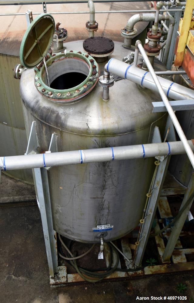 Used TPI Industrial Tank, Approximate 1500 Gallon, Stainless Steel, Vertical. Approximate 72" Diameter x 80" straight side, dished top and bottom. Sidewall baffles, top man way, center bottom outlet....