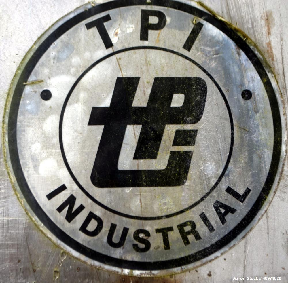 Used TPI Industrial Tank, Approximate 1500 Gallon, Stainless Steel, Vertical. Approximate 72" Diameter x 80" straight side, dished top and bottom. Sidewall baffles, top man way, center bottom outlet....
