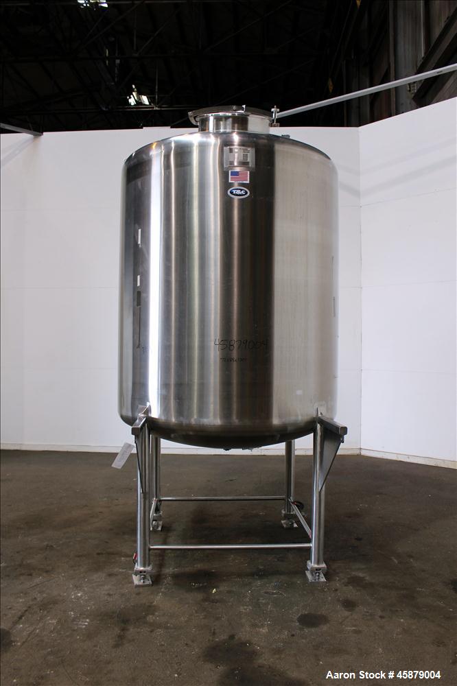 Used T&C Stainless Tank, 1,000 Gallon, 316L Stainless Steel, Vertical. Approximately 65" diameter x 70" straight side. Dished top and bottom. Internal rated 5.25 psi at 250 degrees F. Top opening: 19...