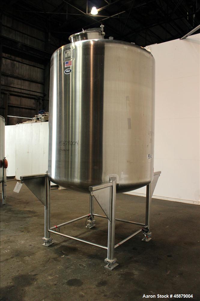 Used T&C Stainless Tank, 1,000 Gallon, 316L Stainless Steel, Vertical. Approximately 65" diameter x 70" straight side. Dished top and bottom. Internal rated 5.25 psi at 250 degrees F. Top opening: 19...