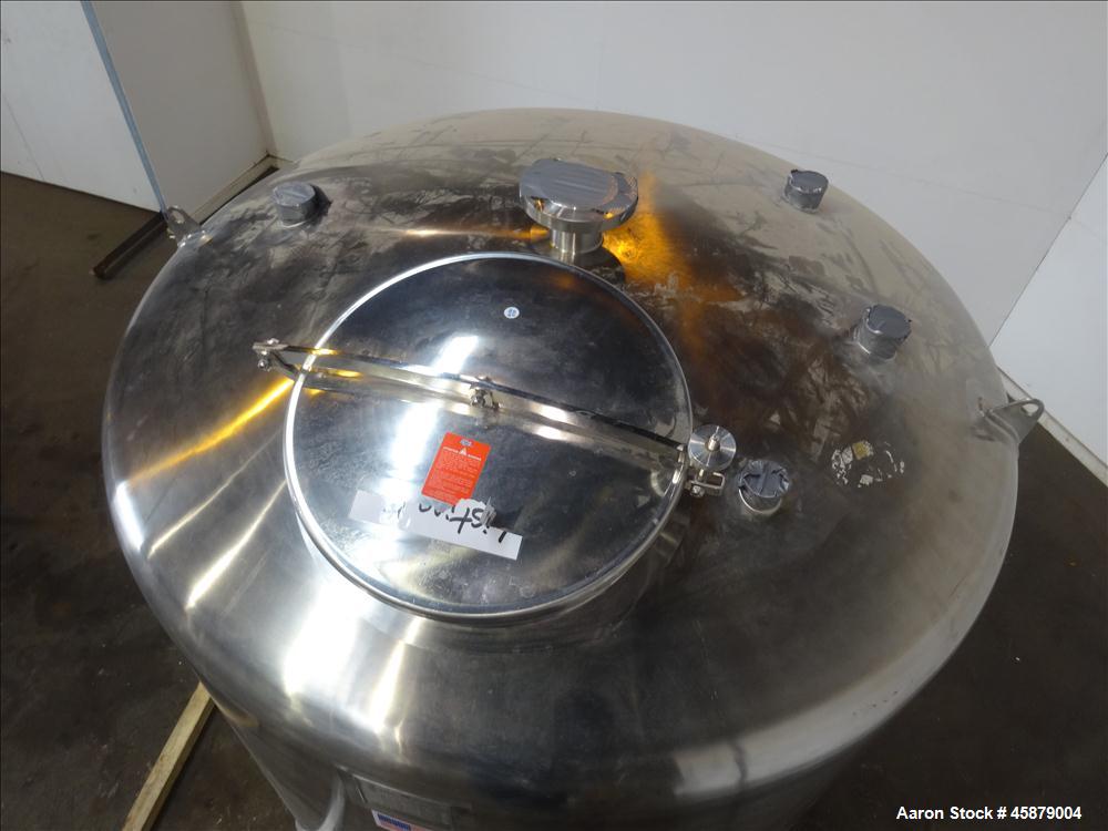 Used T&C Stainless Tank, 1,000 Gallon, 316L Stainless Steel, Vertical. Approximately 65" diameter x 70" straight side. Dished top and bottom. Internal rated 5.25 psi at 250 degrees F. Top opening: 19...