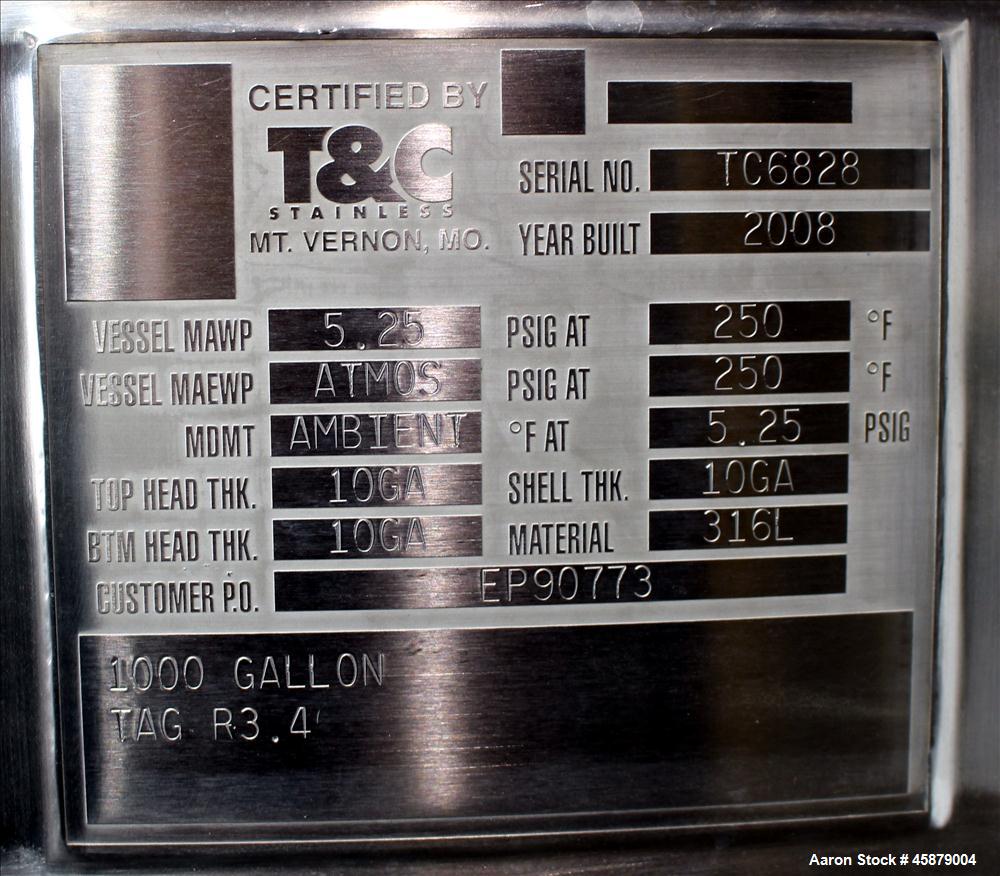 Used T&C Stainless Tank, 1,000 Gallon, 316L Stainless Steel, Vertical. Approximately 65" diameter x 70" straight side. Dished top and bottom. Internal rated 5.25 psi at 250 degrees F. Top opening: 19...