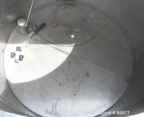 USED: Toronto Coppersmithing Company tank, 1900 gallon, 304 stainless steel, vertical. 84" diameter x 80" straight side. Flat top with 1/3 hinged cover, flat bottom. Carbon steel agitator bridge. Off...
