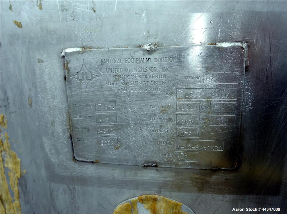 Used United Utensils Tank, 1500 Gallon, 304 Stainless Steel, Vertical. Approximate 67" diameter x 100" straight side. Open top with hinged cover, coned bottom. Approximate 3" center bottom outlet, se...
