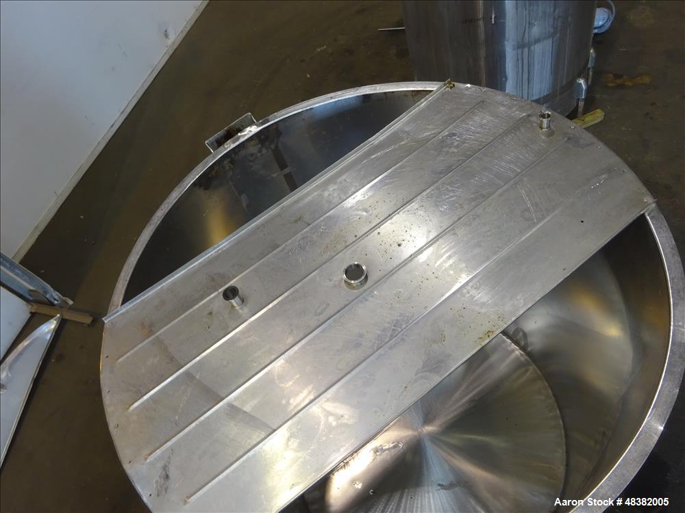 Used Tank, Approximately 2,000 Gallon, 316 Stainless Steel, Vertical. Approximate 80" diameter x 91" straight side, flat top, slopped bottom. (2) 1/3 Hinged covers. 1-1/2" Off center bottom outlet. S...