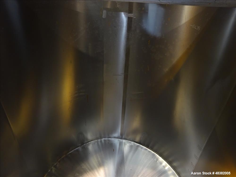 Used Tank, Approximately 2,000 Gallon, 316 Stainless Steel, Vertical. Approximate 80" diameter x 91" straight side, flat top, slopped bottom. (2) 1/3 Hinged covers. 1-1/2" Off center bottom outlet. S...