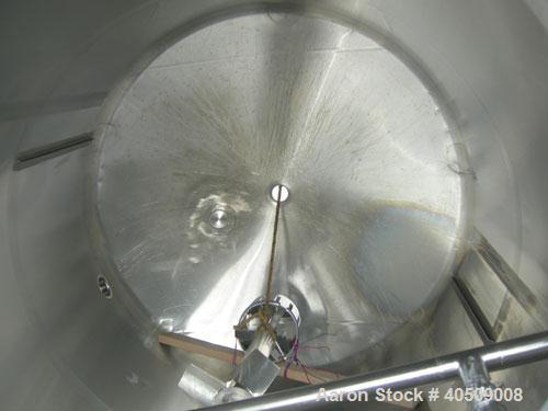 Used Walker Tank, 1000 Gallon, 316 Stainless Steel, Vertical. 66" diameter x 72" straight side, dished top and bottom. Internal rated to 250 deg F. (2) spray balls. Fixed stainless steel agitator bri...