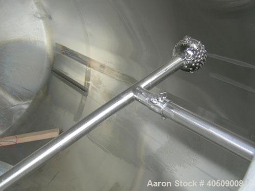 Used Walker Tank, 1000 Gallon, 316 Stainless Steel, Vertical. 66" diameter x 72" straight side, dished top and bottom. Internal rated to 250 deg F. (2) spray balls. Fixed stainless steel agitator bri...