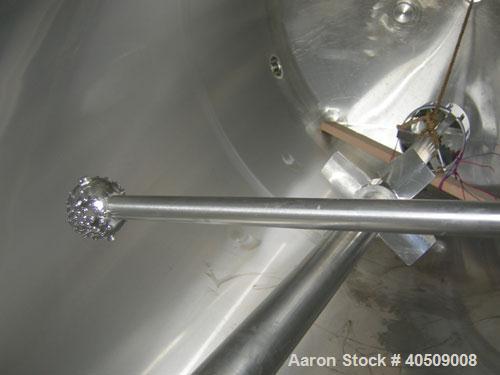 Used Walker Tank, 1000 Gallon, 316 Stainless Steel, Vertical. 66" diameter x 72" straight side, dished top and bottom. Internal rated to 250 deg F. (2) spray balls. Fixed stainless steel agitator bri...