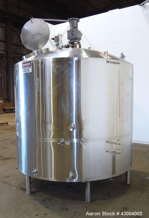 Used Walker Stainless Mix Tank, 1500 Gallon, 304 Stainless Steel, Vertical. Approximate 84" diameter x 64" straight side. Dished top, coned bottom. Internal rated atmospheric at 100 degrees F. Top mo...