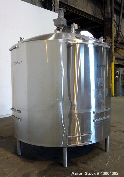 Used Walker Stainless Mix Tank, 1500 Gallon, 304 Stainless Steel, Vertical. Approximate 84" diameter x 64" straight side. Dished top, coned bottom. Internal rated atmospheric at 100 degrees F. Top mo...