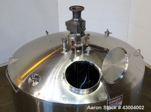 Used Walker Stainless Mix Tank, 1500 Gallon, 304 Stainless Steel, Vertical. Approximate 84" diameter x 64" straight side. Dished top, coned bottom. Internal rated atmospheric at 100 degrees F. Top mo...