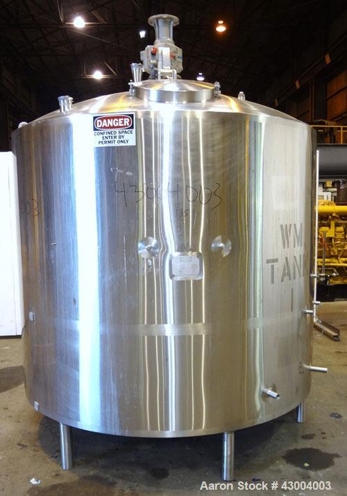 Used Walker Stainless Mix Tank, 1500 Gallon, 304 Stainless Steel, Vertical. Approximate 84” diameter x 64” straight side. Dished top, coned bottom. Internal rated atmospheric at 250 degrees F. Top mo...