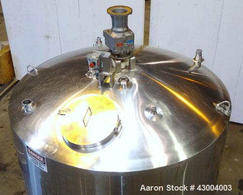 Used Walker Stainless Mix Tank, 1500 Gallon, 304 Stainless Steel, Vertical. Approximate 84” diameter x 64” straight side. Dished top, coned bottom. Internal rated atmospheric at 250 degrees F. Top mo...
