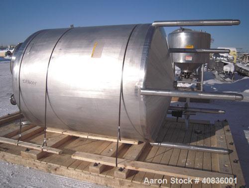 Used Walker Stainless Tank, 1000 Gallon, 316 Stainless Steel, Vertical.  66" diameter x 72" straight side, dished top, coned bottom.  Internal rated atmospheric at 250 deg F.  Off center top entering...