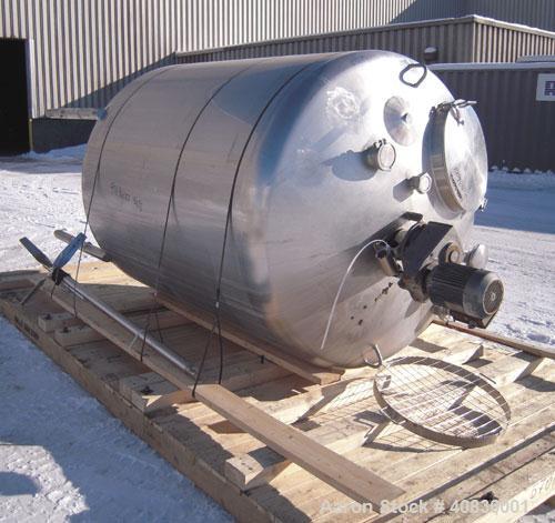 Used Walker Stainless Tank, 1000 Gallon, 316 Stainless Steel, Vertical.  66" diameter x 72" straight side, dished top, coned bottom.  Internal rated atmospheric at 250 deg F.  Off center top entering...