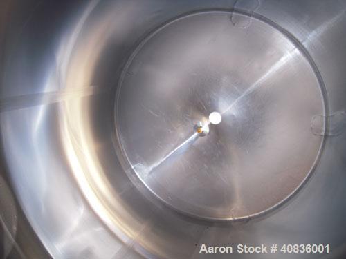 Used Walker Stainless Tank, 1000 Gallon, 316 Stainless Steel, Vertical.  66" diameter x 72" straight side, dished top, coned bottom.  Internal rated atmospheric at 250 deg F.  Off center top entering...