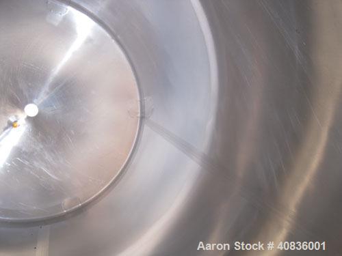 Used Walker Stainless Tank, 1000 Gallon, 316 Stainless Steel, Vertical.  66" diameter x 72" straight side, dished top, coned bottom.  Internal rated atmospheric at 250 deg F.  Off center top entering...