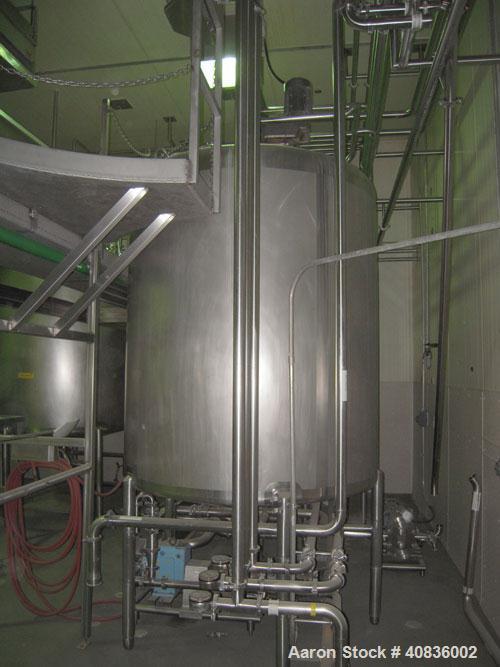 Used Walker Stainless Tank, 1000 gallon, 316 stainless steel, vertical. 66" diameter x 72" straight side, dished top, coned bottom.  Off center top entering agitator, 2" diameter bottom supported sha...