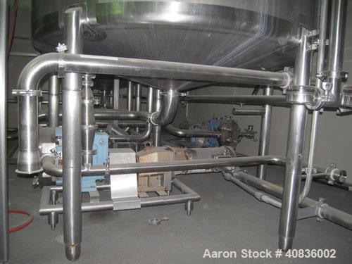Used Walker Stainless Tank, 1000 gallon, 316 stainless steel, vertical. 66" diameter x 72" straight side, dished top, coned bottom.  Off center top entering agitator, 2" diameter bottom supported sha...