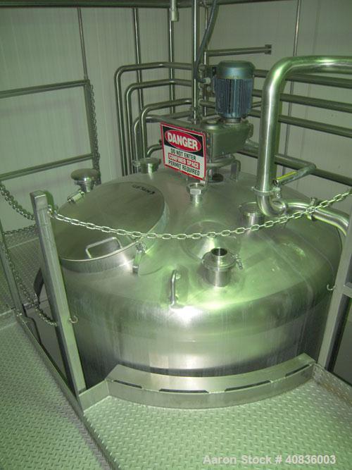 Used Walker Stainless Tank, 1000 gallon, 316 stainless steel, vertical. 66" diameter x 72" straight side, dished top, coned bottom. Off center top entering agitator, 2" diameter bottom supported shaf...