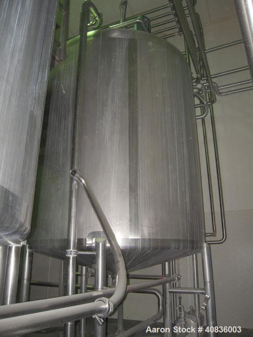 Used Walker Stainless Tank, 1000 gallon, 316 stainless steel, vertical. 66" diameter x 72" straight side, dished top, coned bottom. Off center top entering agitator, 2" diameter bottom supported shaf...