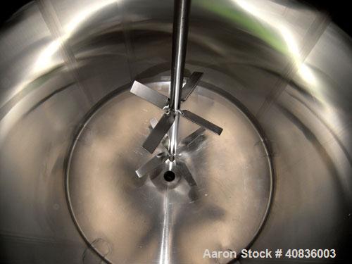 Used Walker Stainless Tank, 1000 gallon, 316 stainless steel, vertical. 66" diameter x 72" straight side, dished top, coned bottom. Off center top entering agitator, 2" diameter bottom supported shaf...
