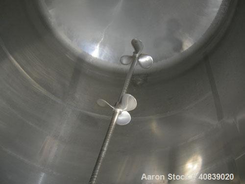 Used Walker Stainless Pressure Tank, 1000 Gallon, 316 stainless steel, vertical. 66" diameter x 72" straight side. Dish top and bottom. Internal rated 25 psi at 100 deg F. Off center top entering Lig...