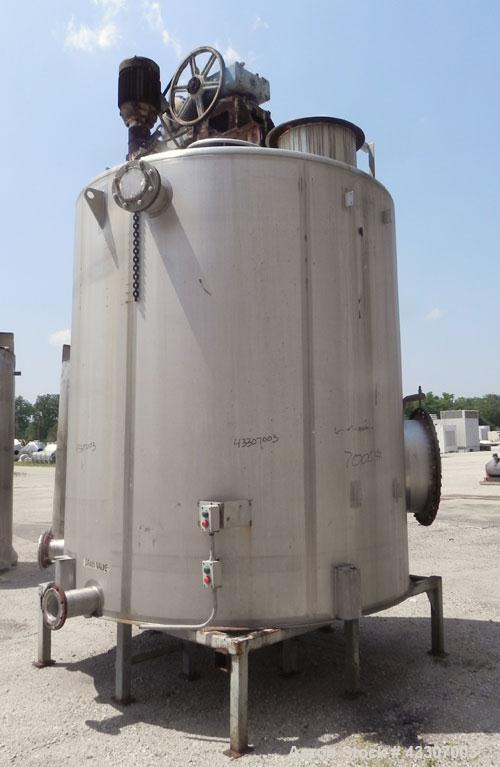 Used Walker Stainless Tank, 4700 Gallon, 304 Stainless Steel, Vertical. Approximate 108” diameter x 120” straight side, coned top, flat bottom. Top entering agitator, with an anchor style blade with ...