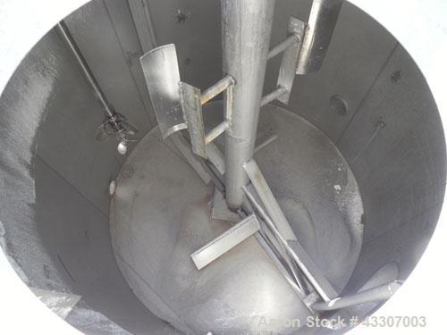 Used Walker Stainless Tank, 4700 Gallon, 304 Stainless Steel, Vertical. Approximate 108” diameter x 120” straight side, coned top, flat bottom. Top entering agitator, with an anchor style blade with ...