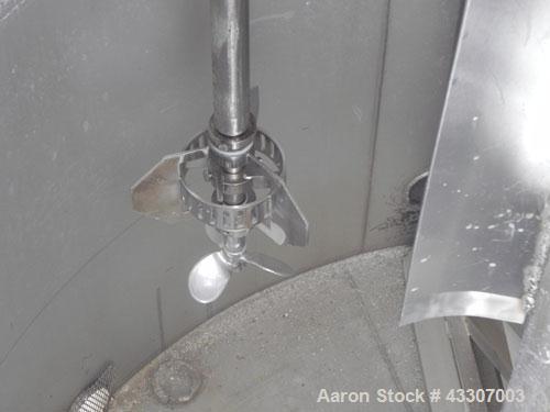 Used Walker Stainless Tank, 4700 Gallon, 304 Stainless Steel, Vertical. Approximate 108” diameter x 120” straight side, coned top, flat bottom. Top entering agitator, with an anchor style blade with ...