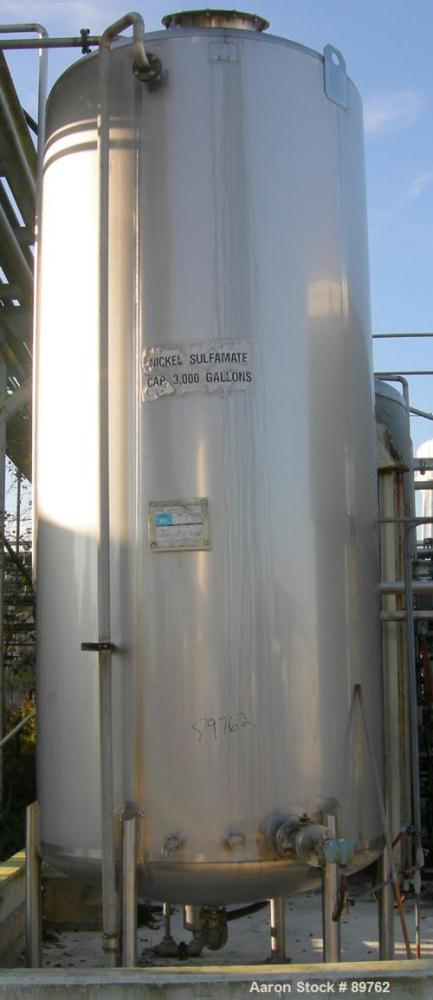 USED: Walker 3,000 gallon, type 304L stainless steel, storage tank. Vertical, dished heads. Approximate 75" diameter x 14' straight side. Misc top and side flanged openings. Bottom has a 2" center ou...