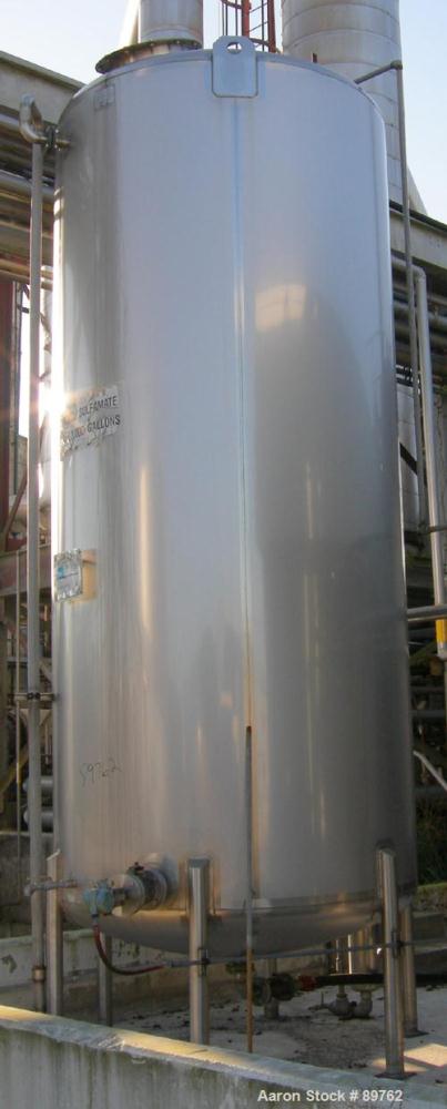 USED: Walker 3,000 gallon, type 304L stainless steel, storage tank. Vertical, dished heads. Approximate 75" diameter x 14' straight side. Misc top and side flanged openings. Bottom has a 2" center ou...